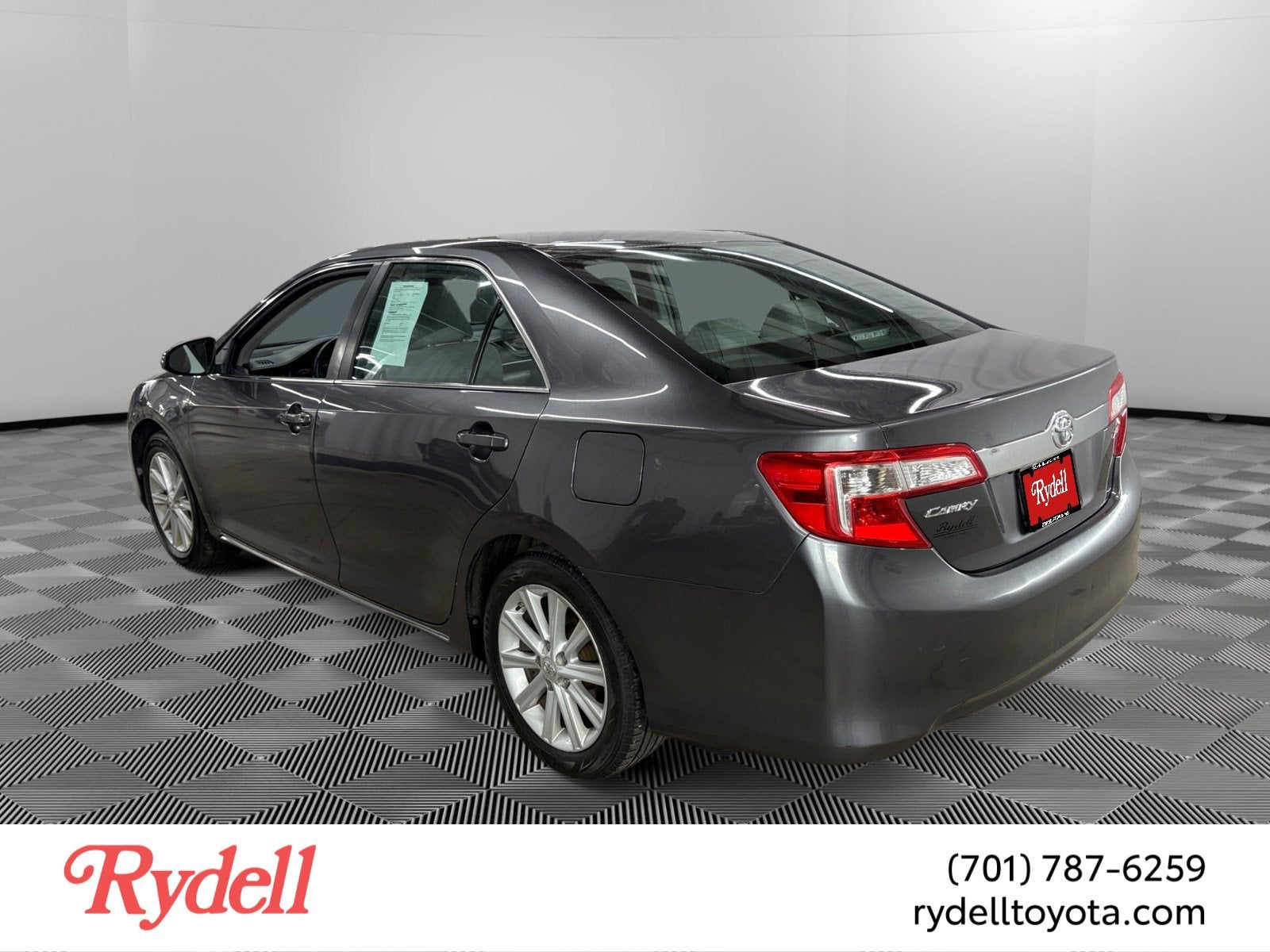 2014 Toyota Camry — rear three-quarter view