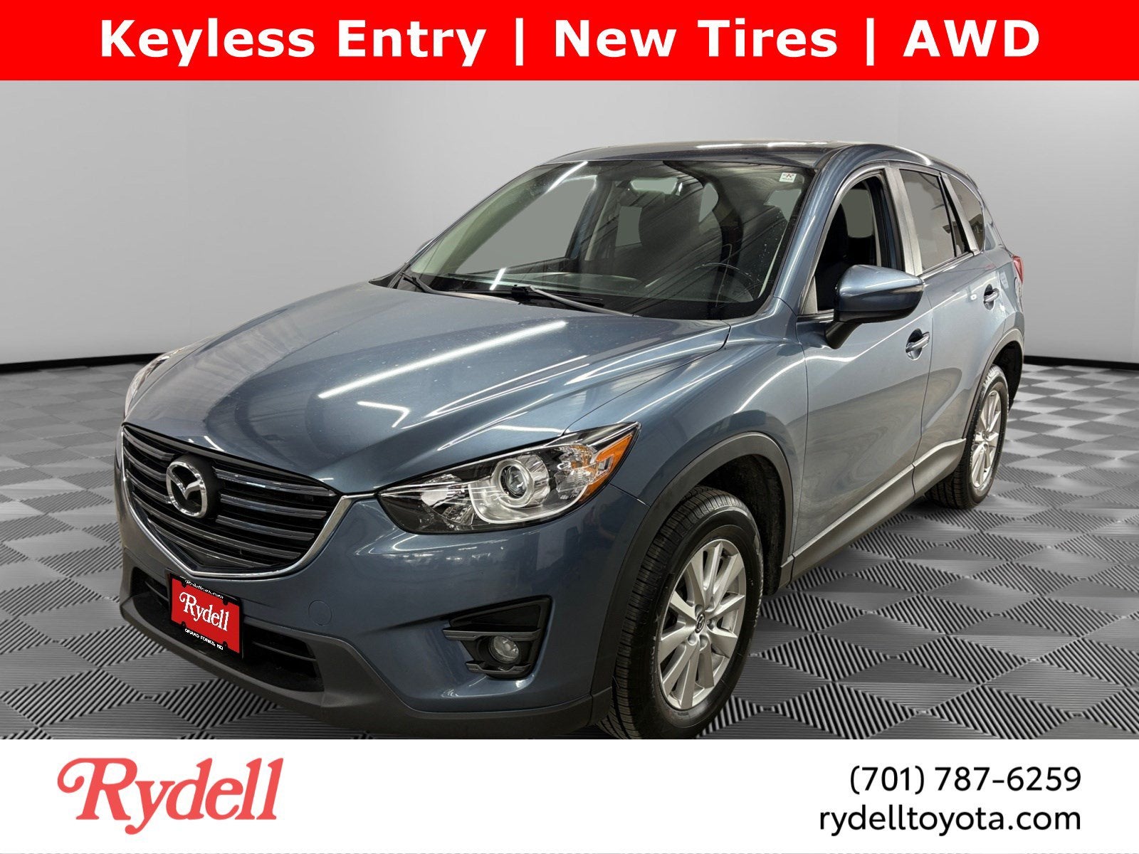 2016 Mazda Mazda CX-5 Touring in Blue Reflex Mica — front three-quarter view