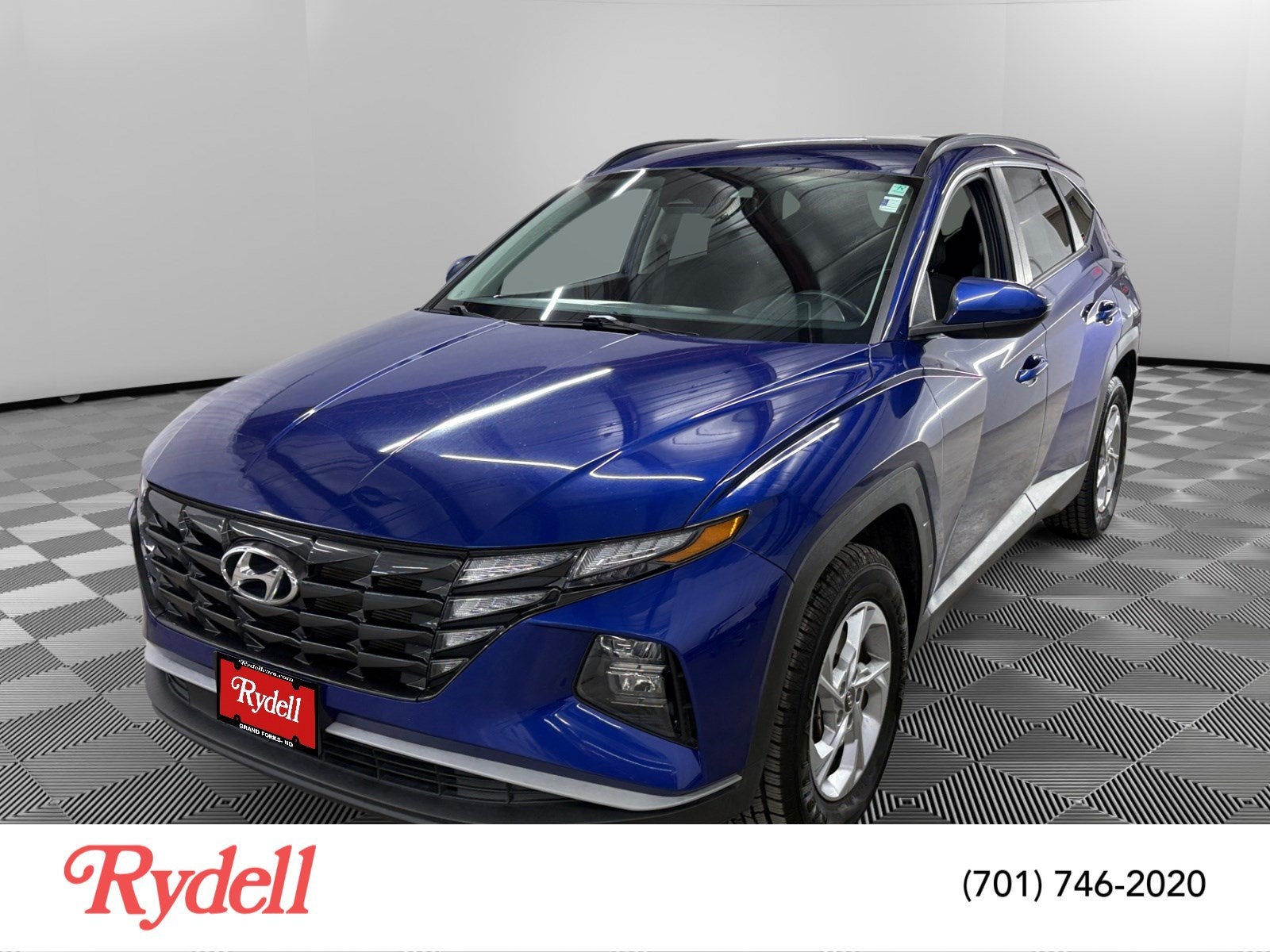 2024 Hyundai Tucson SEL in Intense Blue — front three-quarter view