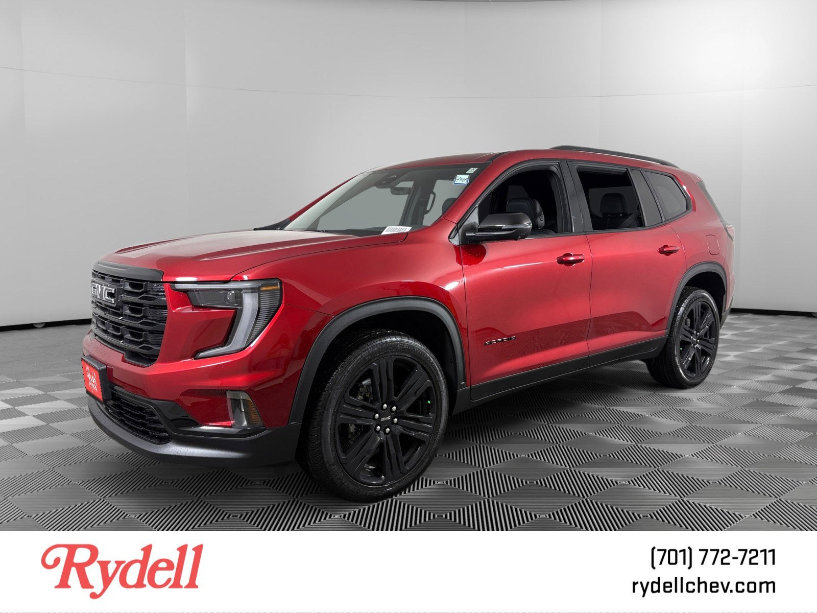 2026 GMC Acadia Elevation in Volcanic Red Tintcoat — front three-quarter view