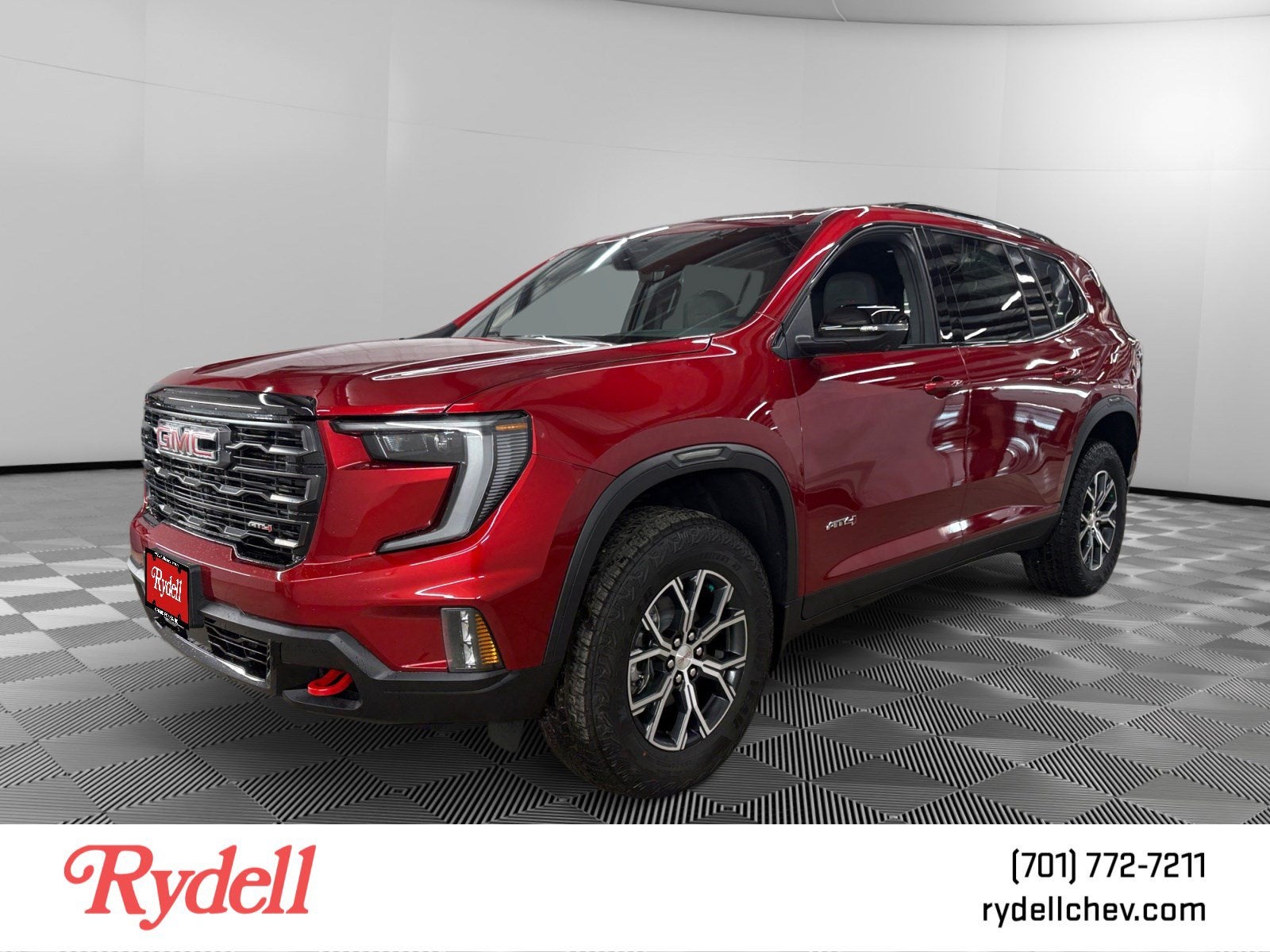 2026 GMC Acadia AT4 in Volcanic Red Tintcoat — front three-quarter view