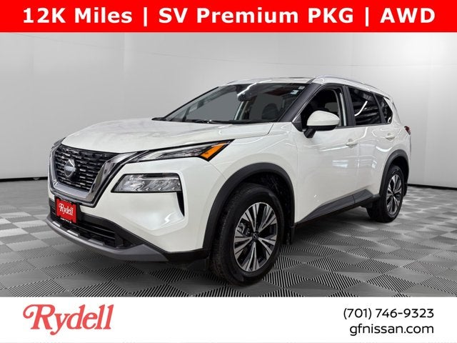 2023 Nissan Rogue SV in Pearl White Tricoat — front three-quarter view